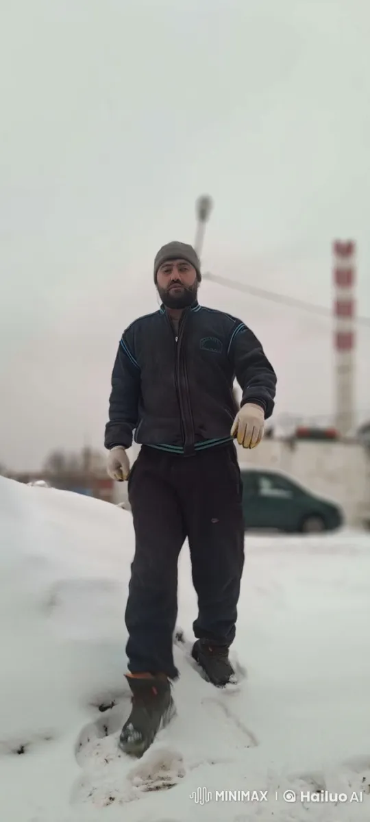 Winter Scene at Factory with Man in Snow – AI Generated Video | Hailuo AI