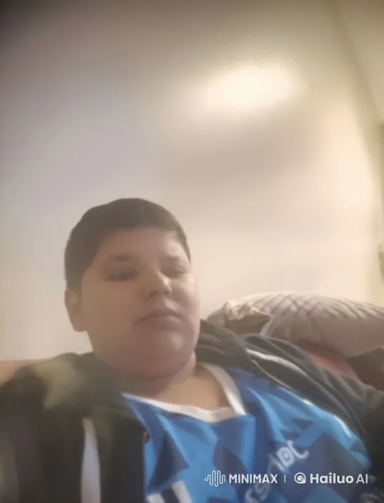 Tranquil Reflection: Person Smokes on Couch in Cozy Setting – AI Generated Video | Hailuo AI