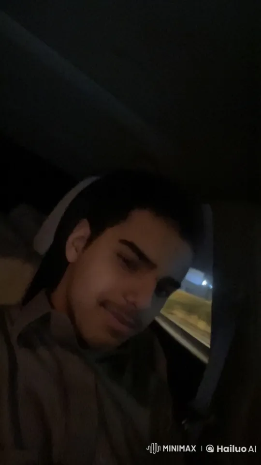 Young Man Smoking in Motion-Lit Car at Night – AI Generated Video | Hailuo AI