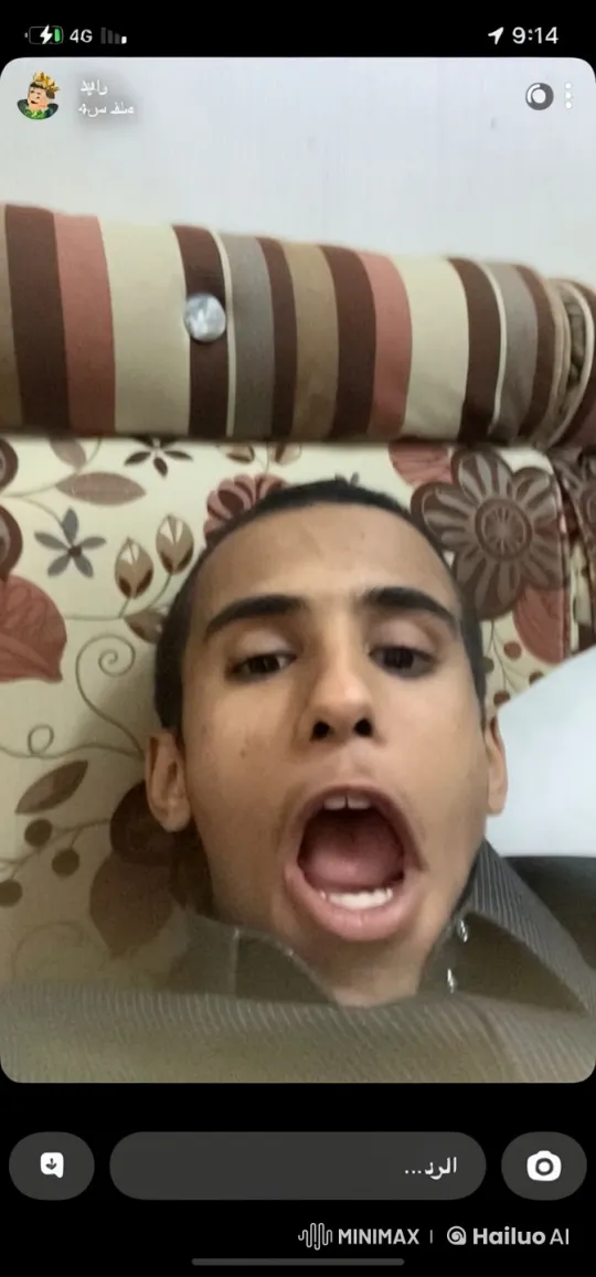 Young Man Smokes Leisurely on Patterned Couch – AI Generated Video | Hailuo AI