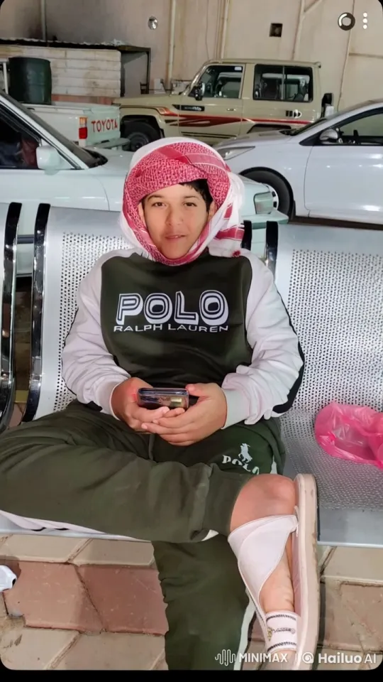 Person in Tracksuit Smokes, Watches Phone on Bench – AI Generated Video | Hailuo AI