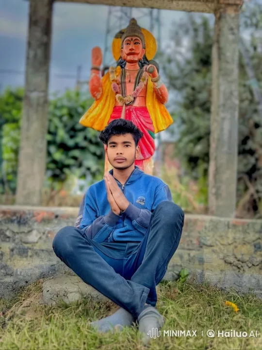 Young Man in Contemplative Pose Amidst Serene Outdoor Setting – AI Generated Video | Hailuo AI