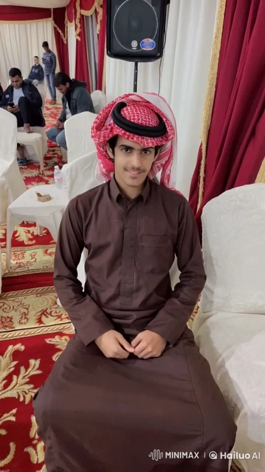 Young Man Smoking in Red and Gold-Themed Tent – AI Generated Video | Hailuo AI