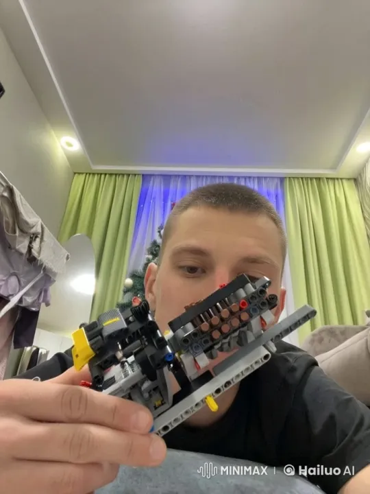 Man Shares Tender Kiss with Friend Amid Lego Building – AI Generated Video | Hailuo AI