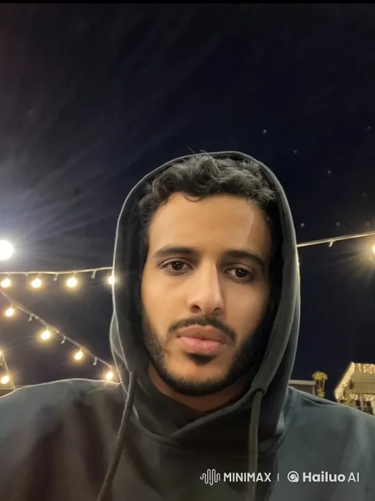 Nighttime Reflection: A Person Smoking Under String Lights – AI Generated Video | Hailuo AI
