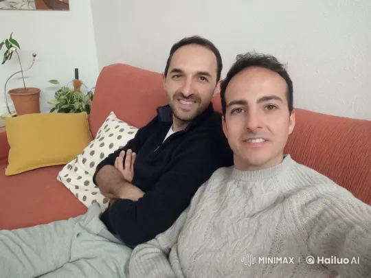 Dancing Duo on an Orange Couch – AI Generated Video | Hailuo AI