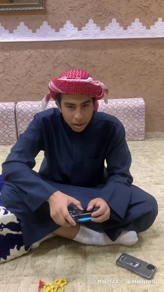Young Man Balances Gaming and Smoking in Traditional Setting – AI Generated Video | Hailuo AI