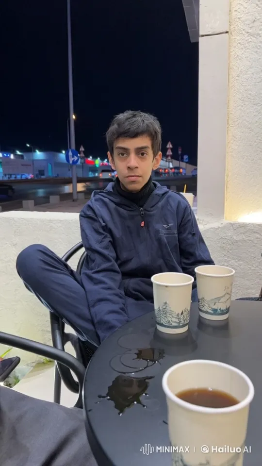 Young Person Reflecting at Night with Drinks and Smoke – AI Generated Video | Hailuo AI
