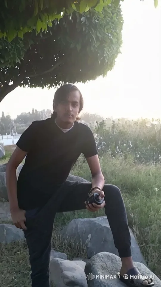 Young Man Smoking in Tranquil Outdoor Setting – AI Generated Video | Hailuo AI