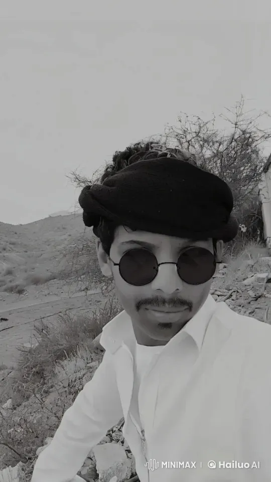 Traditional Figure Contemplates in Arid Landscape – AI Generated Video | Hailuo AI