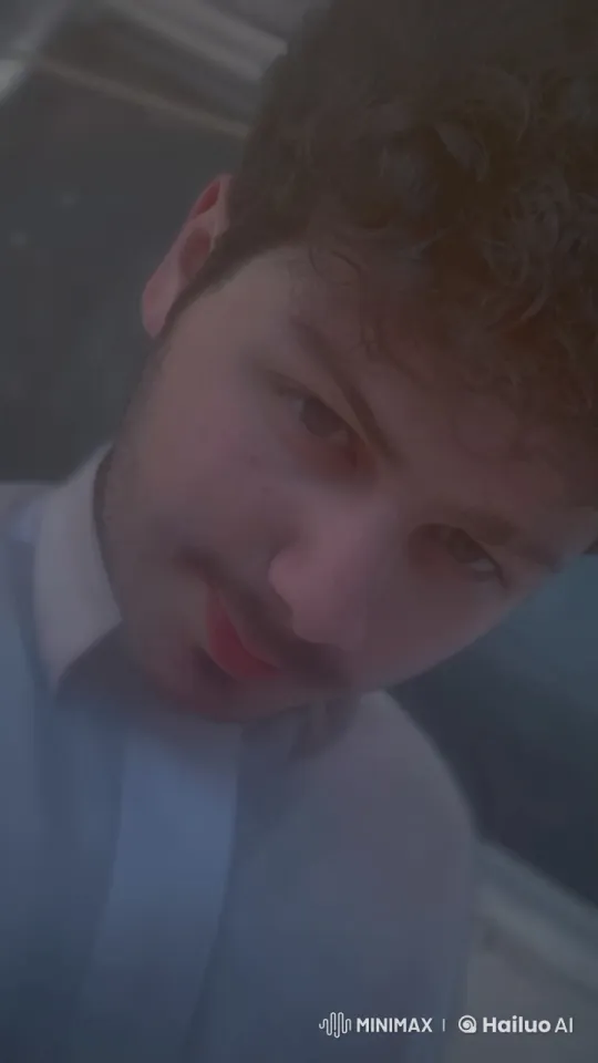 Young Man Reflectively Smokes, Focused Gaze – AI Generated Video | Hailuo AI