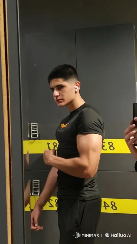 Young Man in Gym Locker Room Flexing, Smoking – AI Generated Video | Hailuo AI