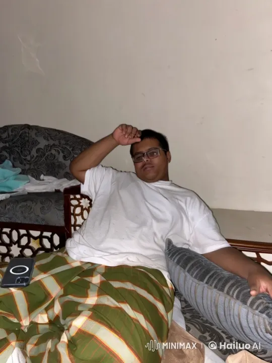 Man Relaxing with Cigarette on Couch – AI Generated Video | Hailuo AI
