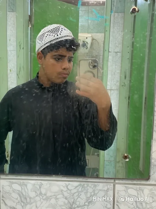 Man Smokes in Quiet Bathroom with Green Tiles – AI Generated Video | Hailuo AI