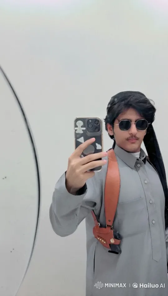 Man in Traditional Attire Takes Selfie Smoking – AI Generated Video | Hailuo AI