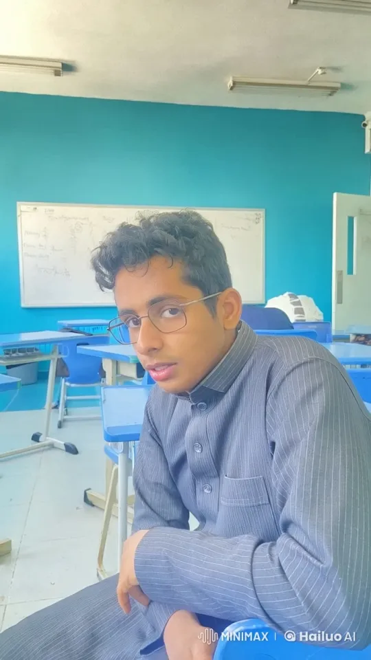 Young Man Smokes Calmly in Classroom Setting – AI Generated Video | Hailuo AI