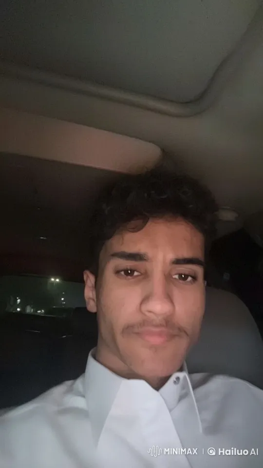 Contemplative Young Man Smoking in Dimly Lit Car – AI Generated Video | Hailuo AI