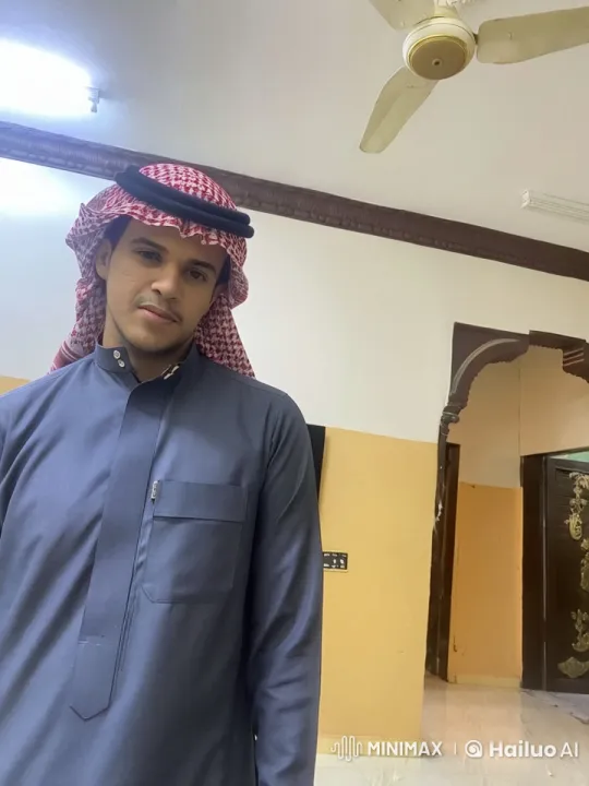 Traditional Attire: Man Smokes in Beige-Room Setting – AI Generated Video | Hailuo AI