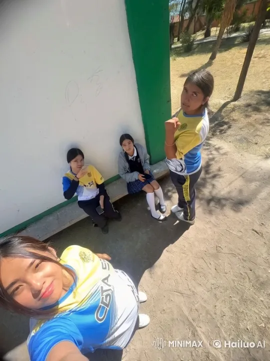 Four Students in Uniforms Chatting by a Wall – AI Generated Video | Hailuo AI