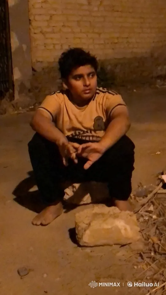 Person Smoking by Brick Wall in Quiet Evening – AI Generated Video | Hailuo AI