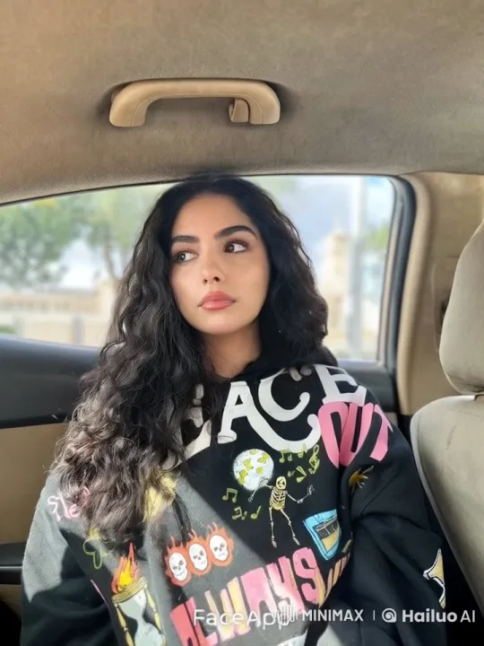 Young Woman Smoking in Graphic Hoodie in Car – AI Generated Video | Hailuo AI