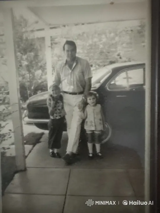 Man and Two Children in Driveway with Car – AI Generated Video | Hailuo AI