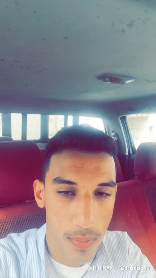 Man Smoking in Car with Maroon Seats – AI Generated Video | Hailuo AI
