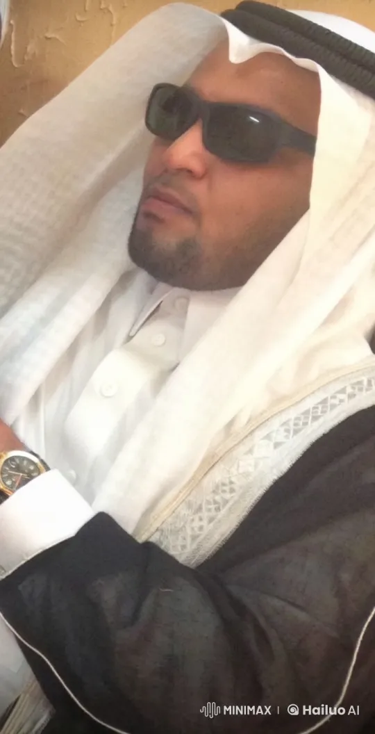 Man in Traditional Attire Smokes Calmly – AI Generated Video | Hailuo AI