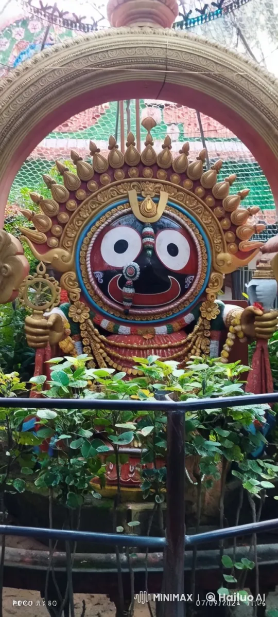 Vibrant Deity Statue in Serene Garden Setting – AI Generated Video | Hailuo AI