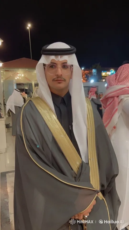 Man Smoking in Traditional Attire at Nighttime Gathering – AI Generated Video | Hailuo AI