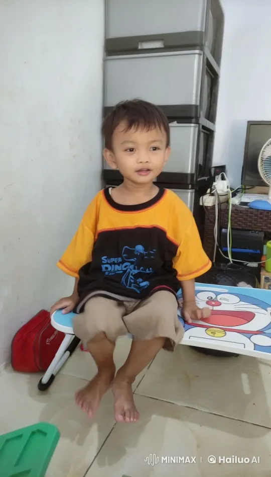 Young Boy in Super Dino Shirt Relaxing on Doraemon Chair – AI Generated Video | Hailuo AI