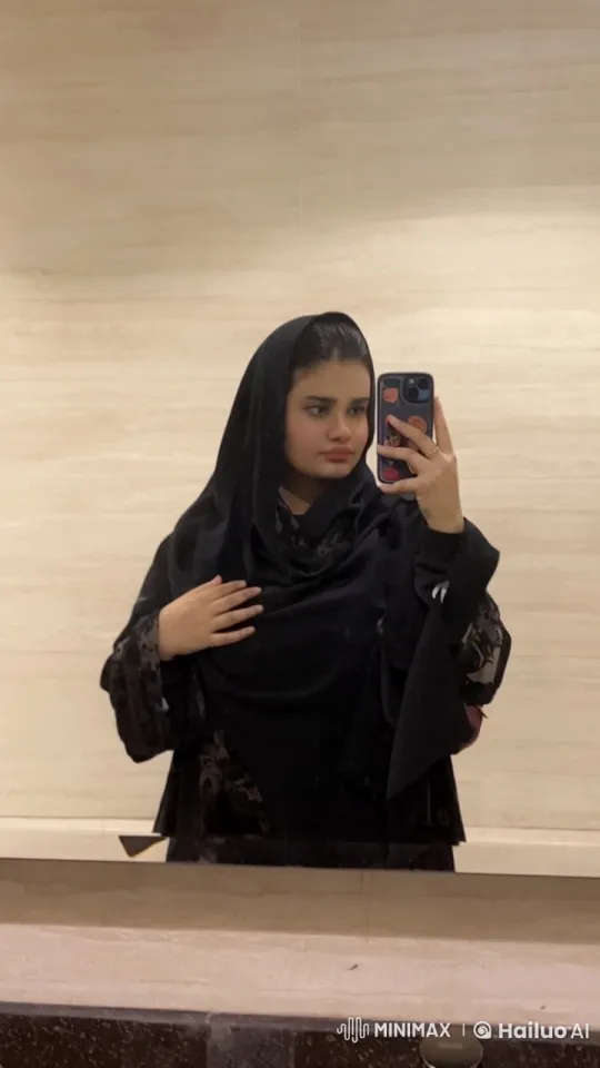 Woman Taking Selfie, Adjusting Scarf, Smoking – AI Generated Video | Hailuo AI