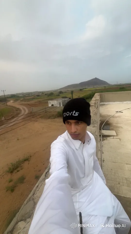 Rural Serenity: Person Smoking on Rooftop with Countryside View – AI Generated Video | Hailuo AI