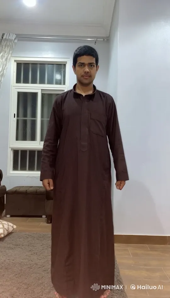 Traditional Attire, Smoking Scene in a Well-Lit Room – AI Generated Video | Hailuo AI