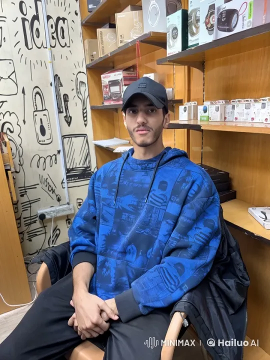 Young Person Smoking in Tech Store with Creative Doodles – AI Generated Video | Hailuo AI
