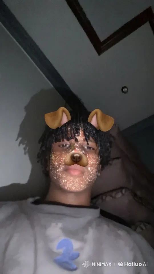 Relaxed Person Smoking with Digital Dog Ears in Dim Room – AI Generated Video | Hailuo AI
