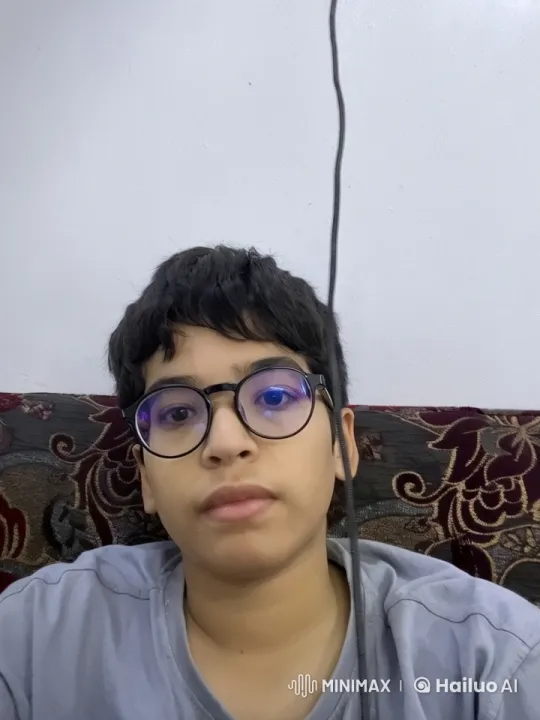 Young Person Contemplatively Smokes on Patterned Couch – AI Generated Video | Hailuo AI