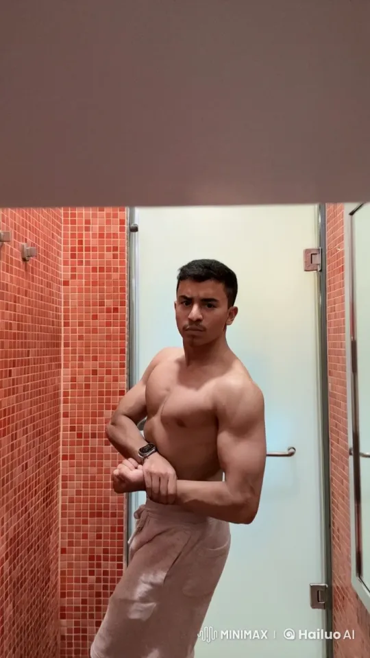 Shirtless Person Flexes, Smokes in Bathroom – AI Generated Video | Hailuo AI