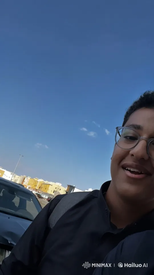 Person Smokes in Front of Buildings on a Sunny Day – AI Generated Video | Hailuo AI