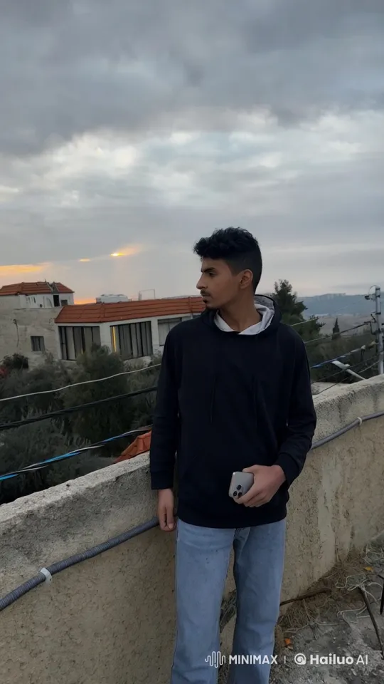 Young Man Reflects on Rooftop With Cigarette – AI Generated Video | Hailuo AI