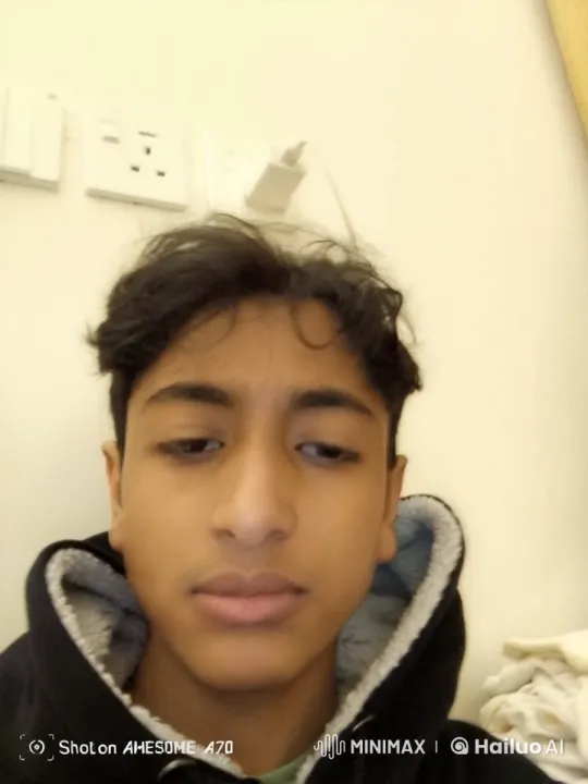 Person Smoking in a Light-Colored Room – AI Generated Video | Hailuo AI