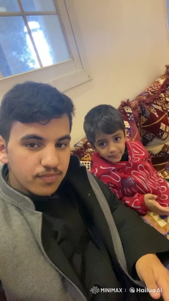 Young Man and Boy on Sofa with Smoking Scene – AI Generated Video | Hailuo AI