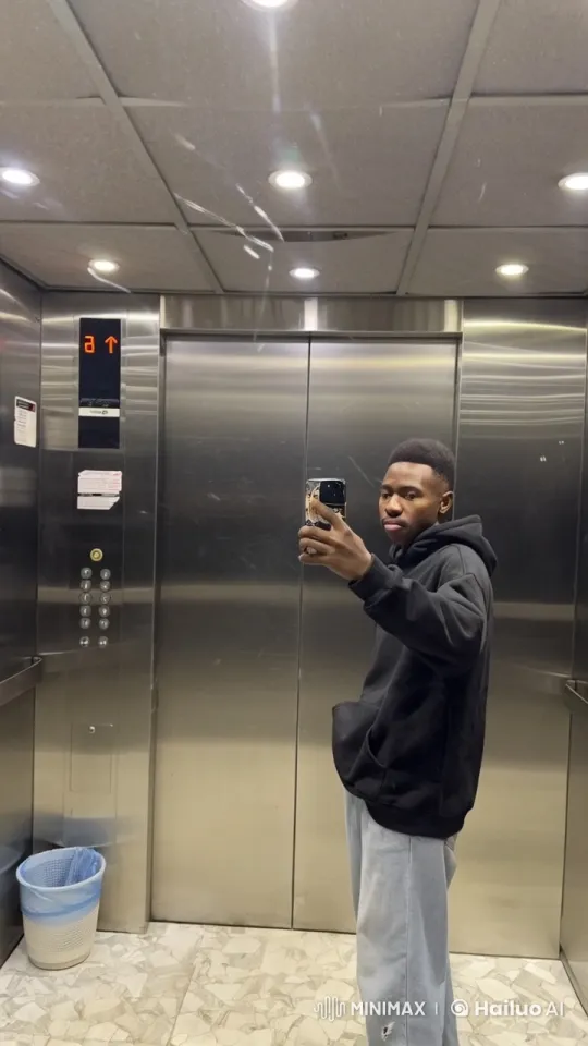 Young Man Smoking in Elevator, Taking Selfie – AI Generated Video | Hailuo AI