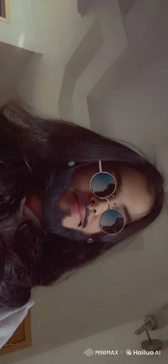 Person Smoking with Round Sunglasses in Relaxing Room – AI Generated Video | Hailuo AI