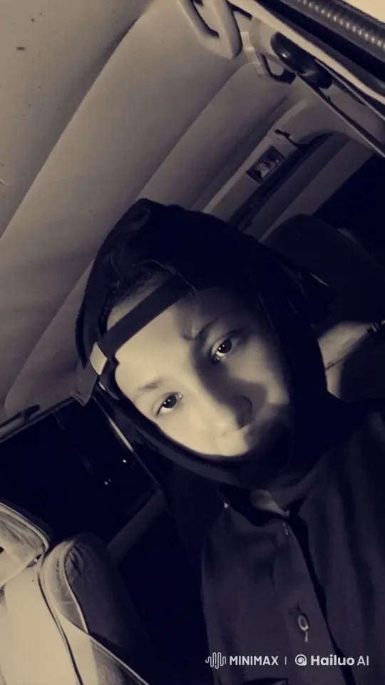 Contemplative Individual in a Dimly Lit Car – AI Generated Video | Hailuo AI