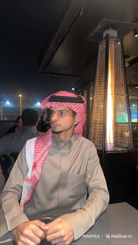 Nighttime Cafe Scene: Man Smokes by Heater – AI Generated Video | Hailuo AI