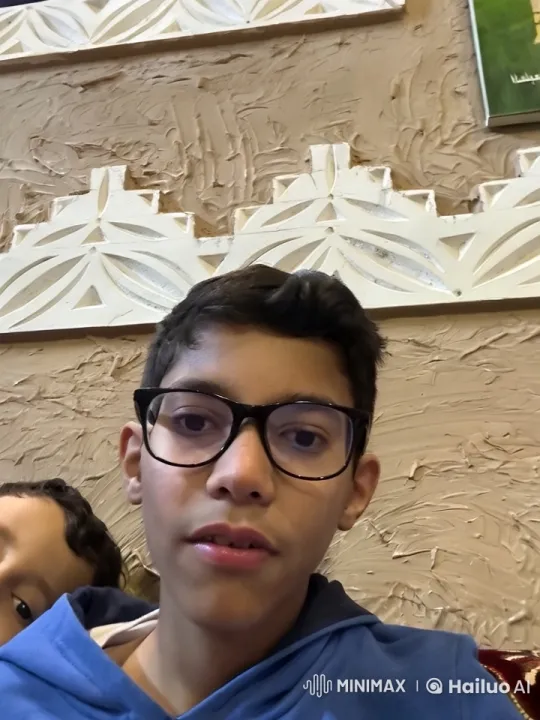 Boys Sitting by Textured Wall with Smoking Interaction – AI Generated Video | Hailuo AI