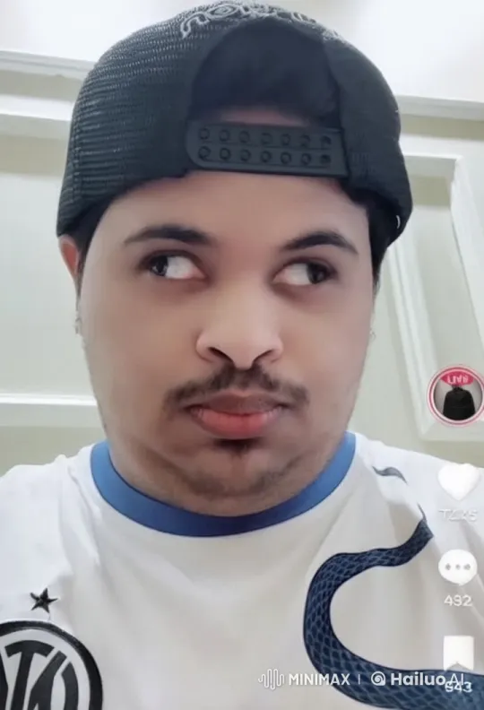 Man in Cap and Jersey Smokes Casually Indoors – AI Generated Video | Hailuo AI
