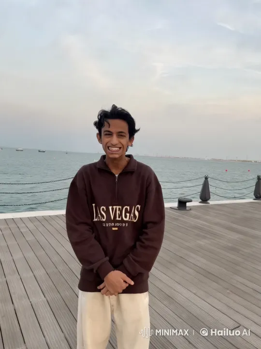 Young Man Smokes on Seaside Platform – AI Generated Video | Hailuo AI