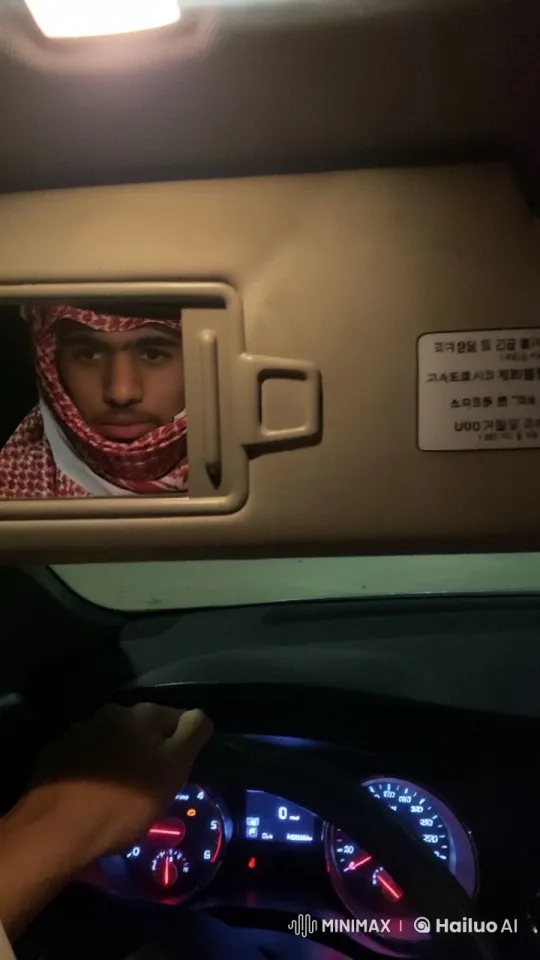 Nighttime Reflection: Driver in Traditional Attire Smoking – AI Generated Video | Hailuo AI